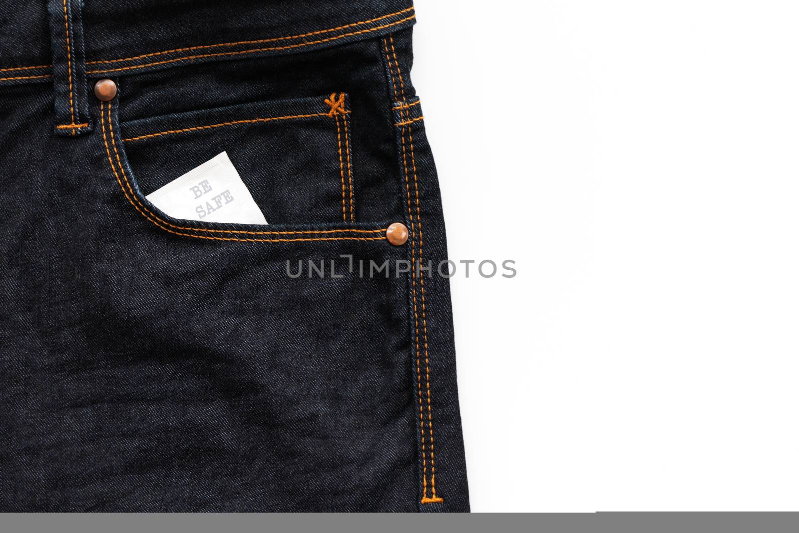 Condom in the jeans pocket with word be safe