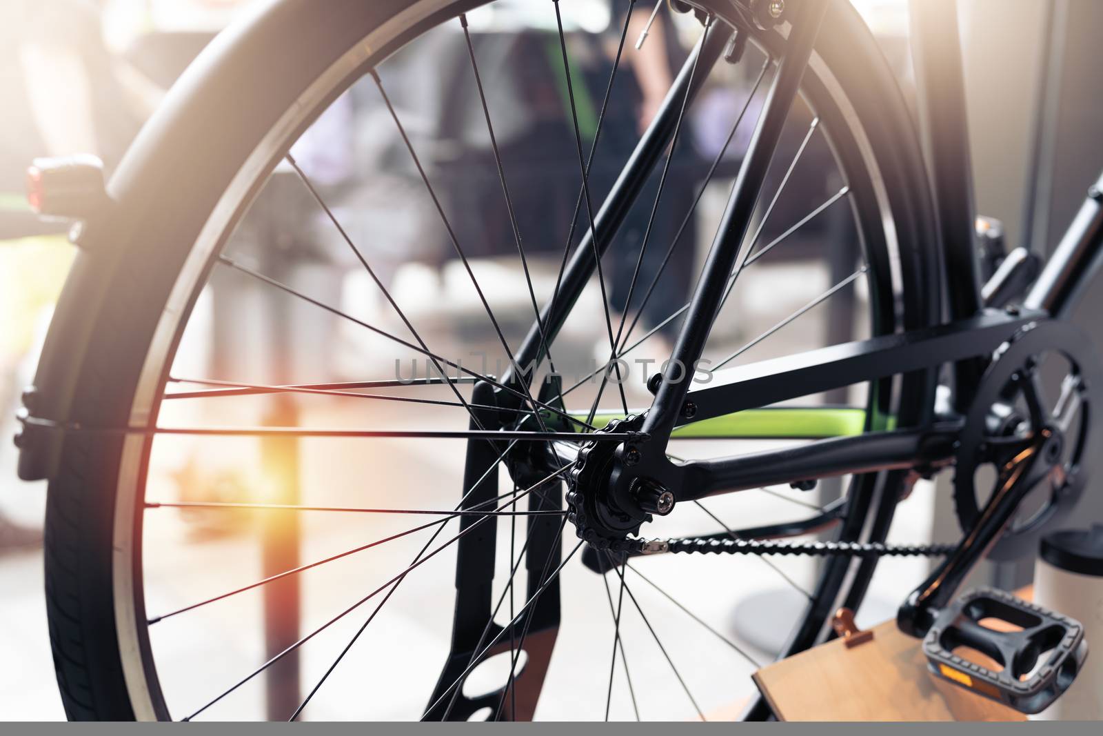 black wheel bicycle closeup on vintage scene