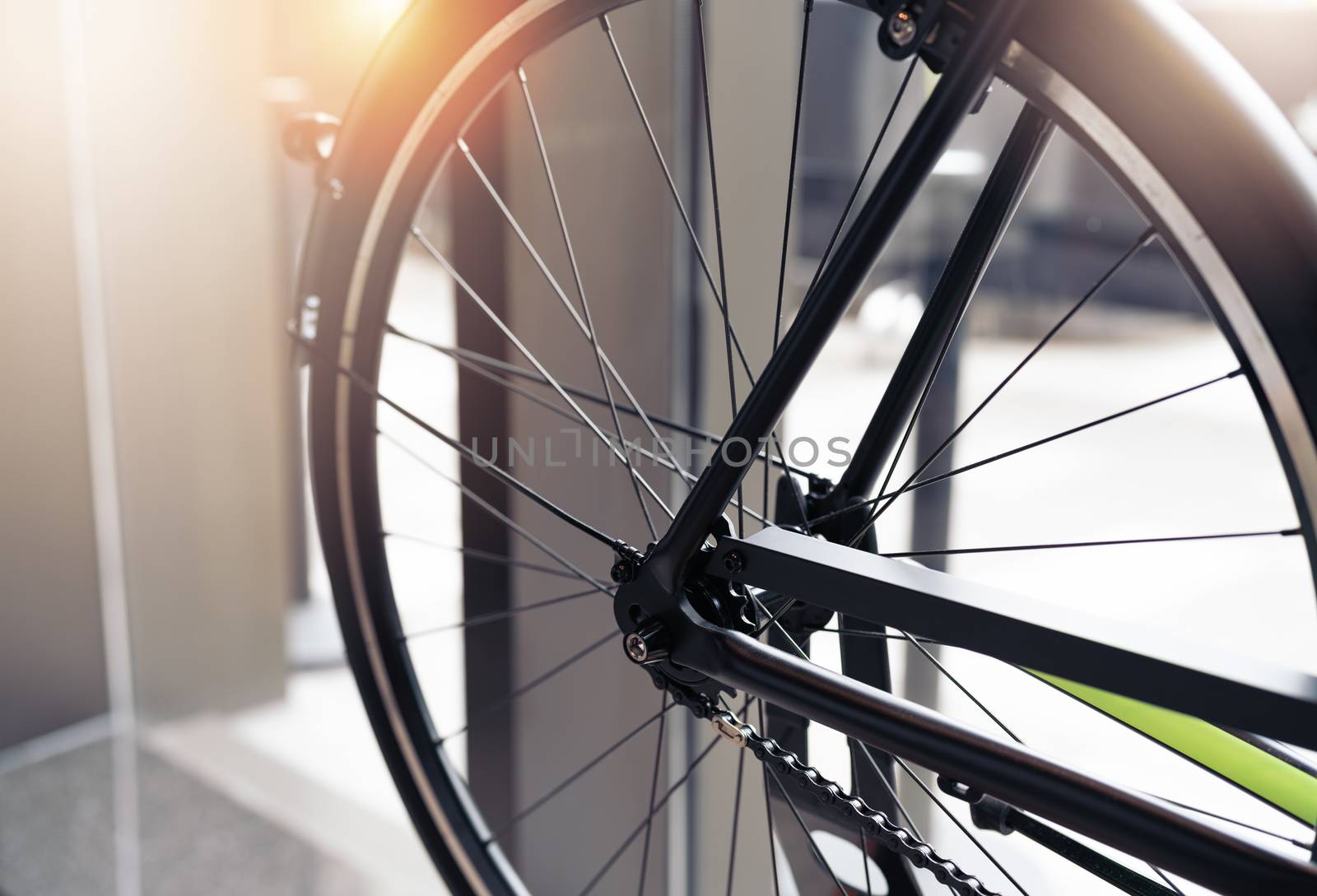black wheel bicycle closeup on vintage scene