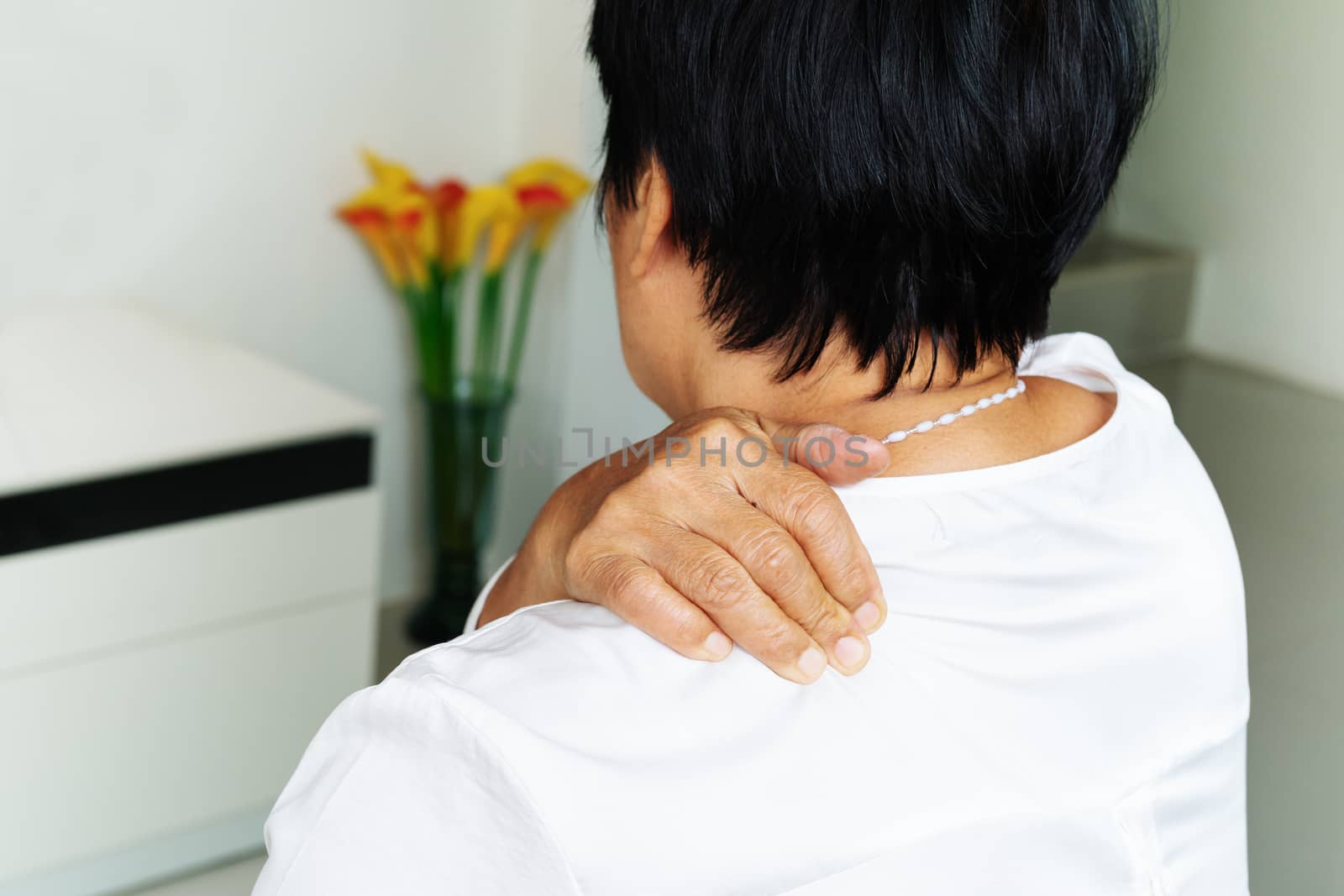 neck and shoulder pain, old woman suffering from neck and shoulder injury, health problem concept