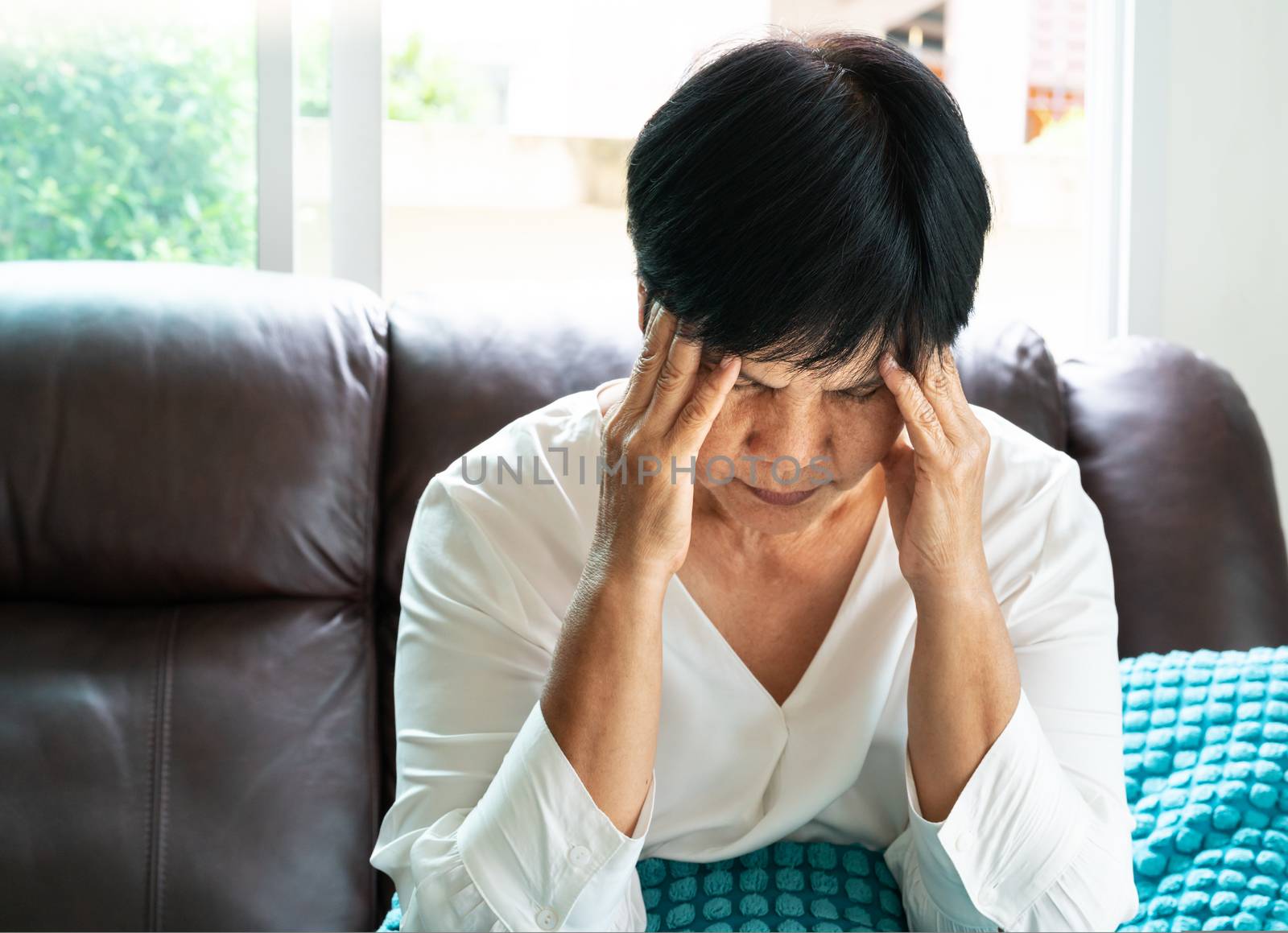 old woman suffering from headache, stress, migraine, health problem concept