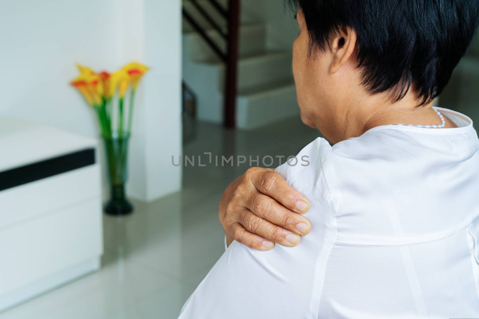 neck and shoulder pain, old woman suffering from neck and shoulder injury, health problem concept
