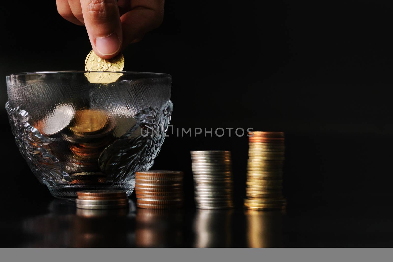 add saving coin to coin cup, money saving concept