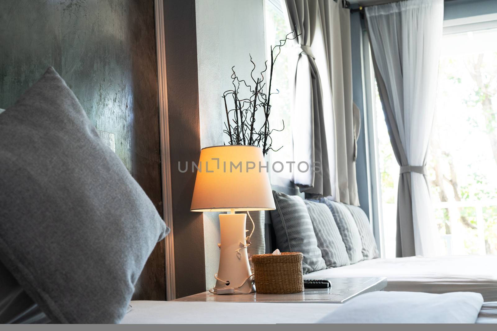 comfortable living room, grey pillow and desk lamp