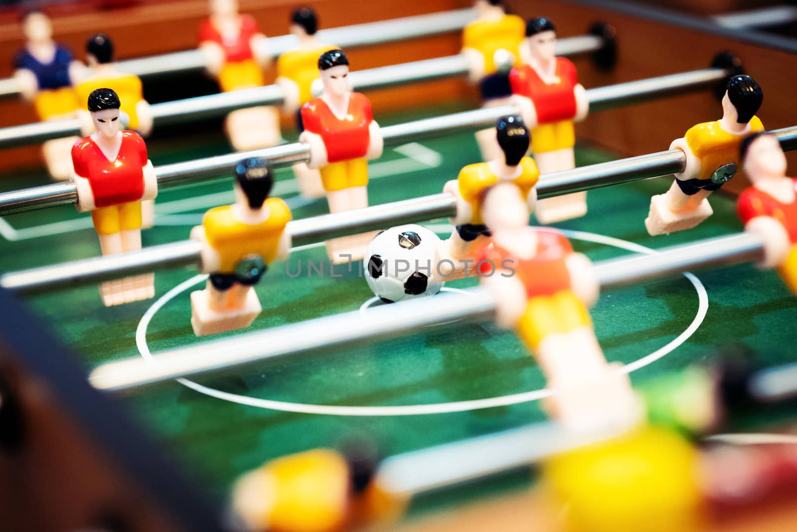 Foosball table soccer. football player, sport concept