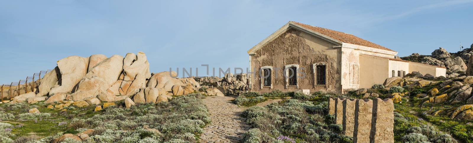 rocks and sea in palua on sardinia island by compuinfoto