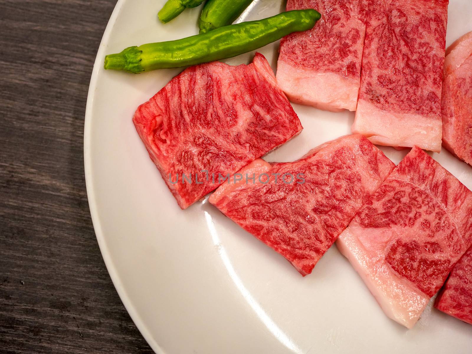 Matsusaka Beef on white plate in yakiniku restaurant. Matsusaka City, Japan. (Japan's Most Expensive Beef)