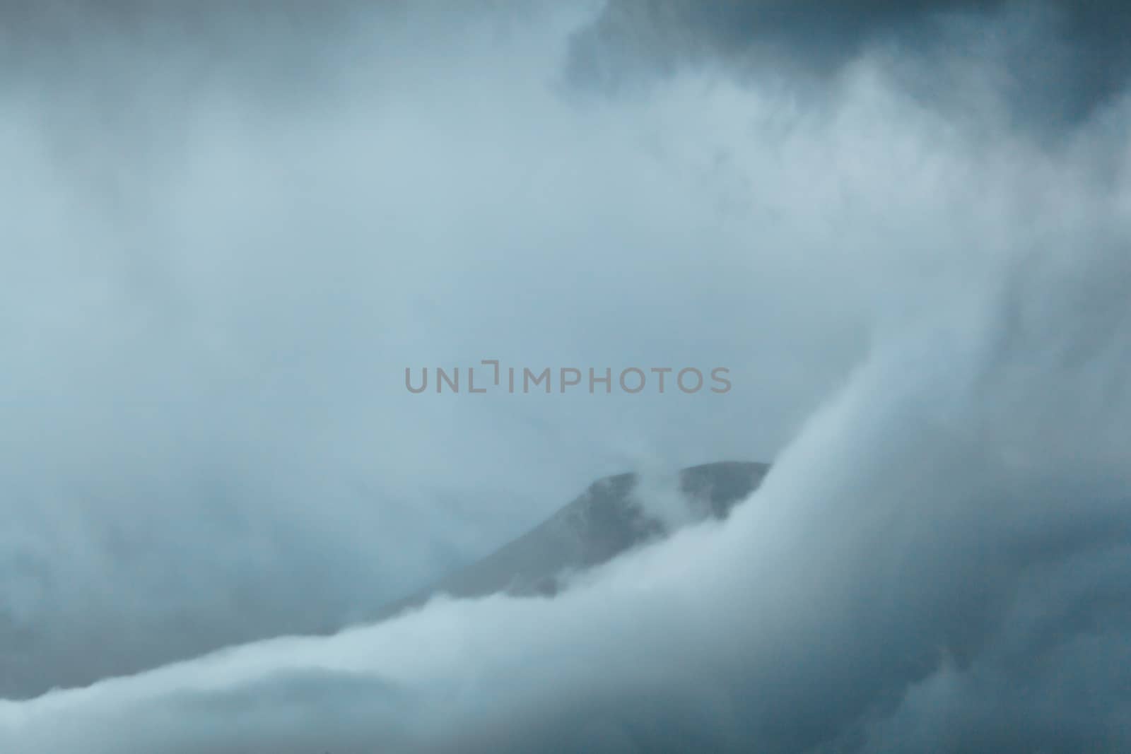 Athabasca glacier covered with clouds, close-up