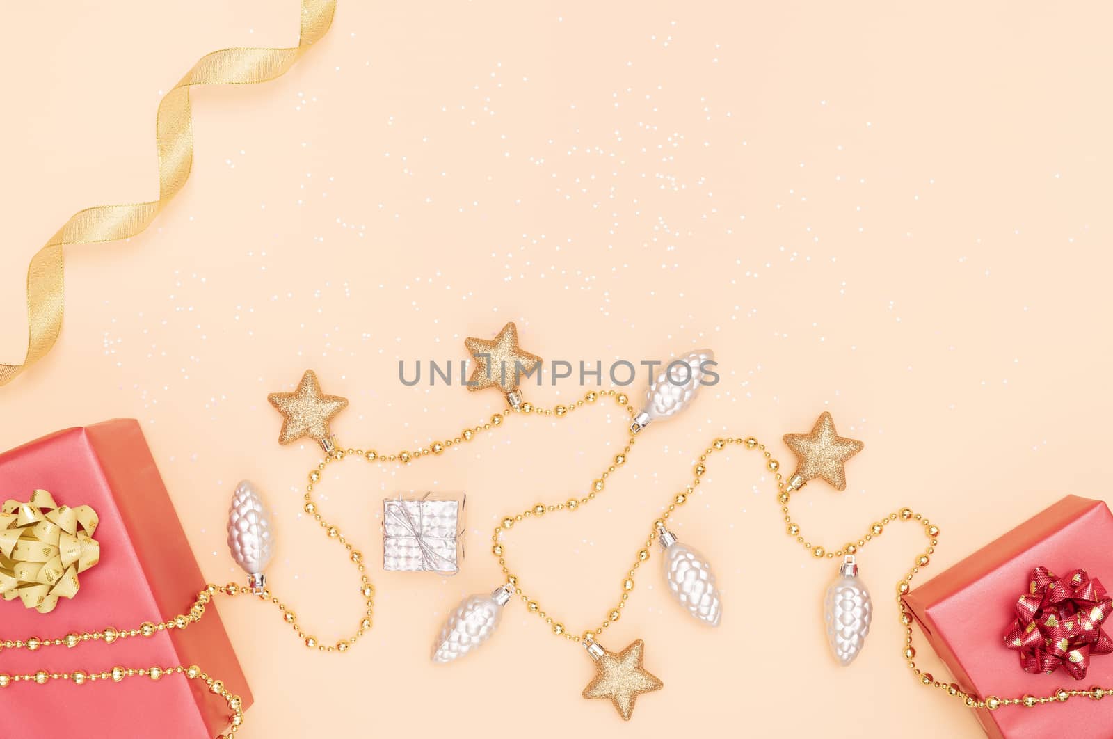 gifts boxes or presents boxes with red bows, star and ball on golden background for birthday, christmas or wedding ceremony