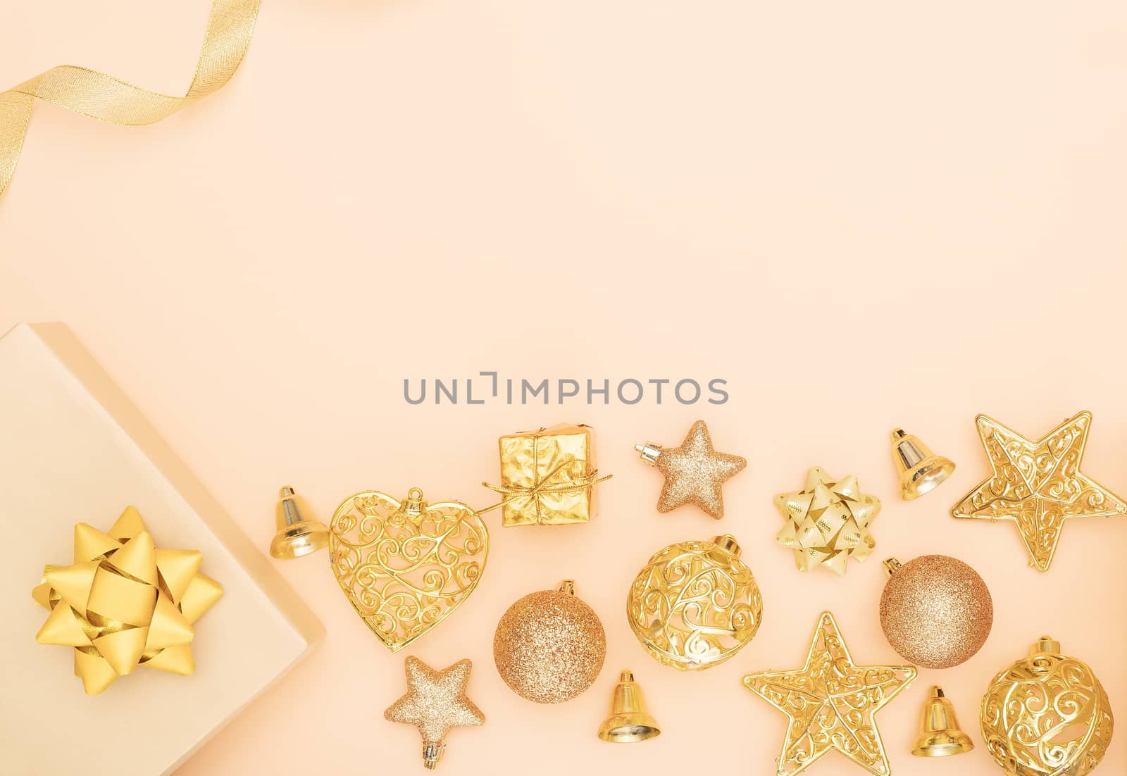 gifts boxes or presents boxes with golden bows, star and ball on golden background for birthday, christmas or wedding ceremony