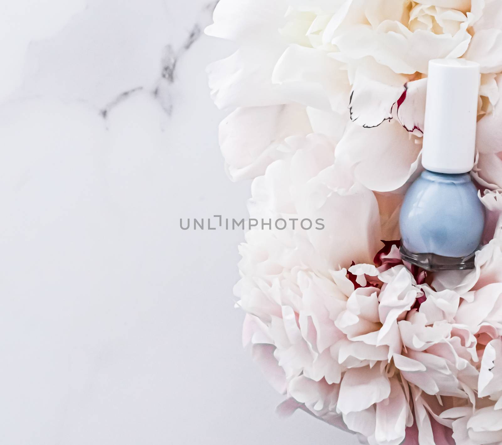 Nail polish bottles on floral background, french manicure and cosmetic branding design