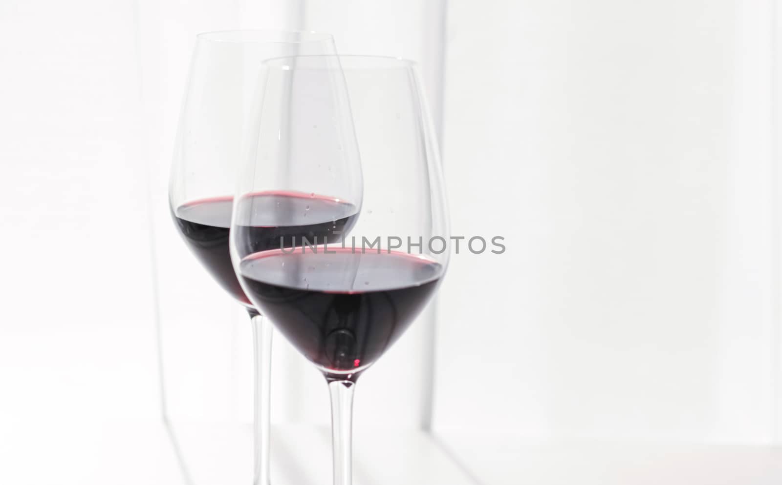 Two crystal glasses of red wine, organic beverage product
