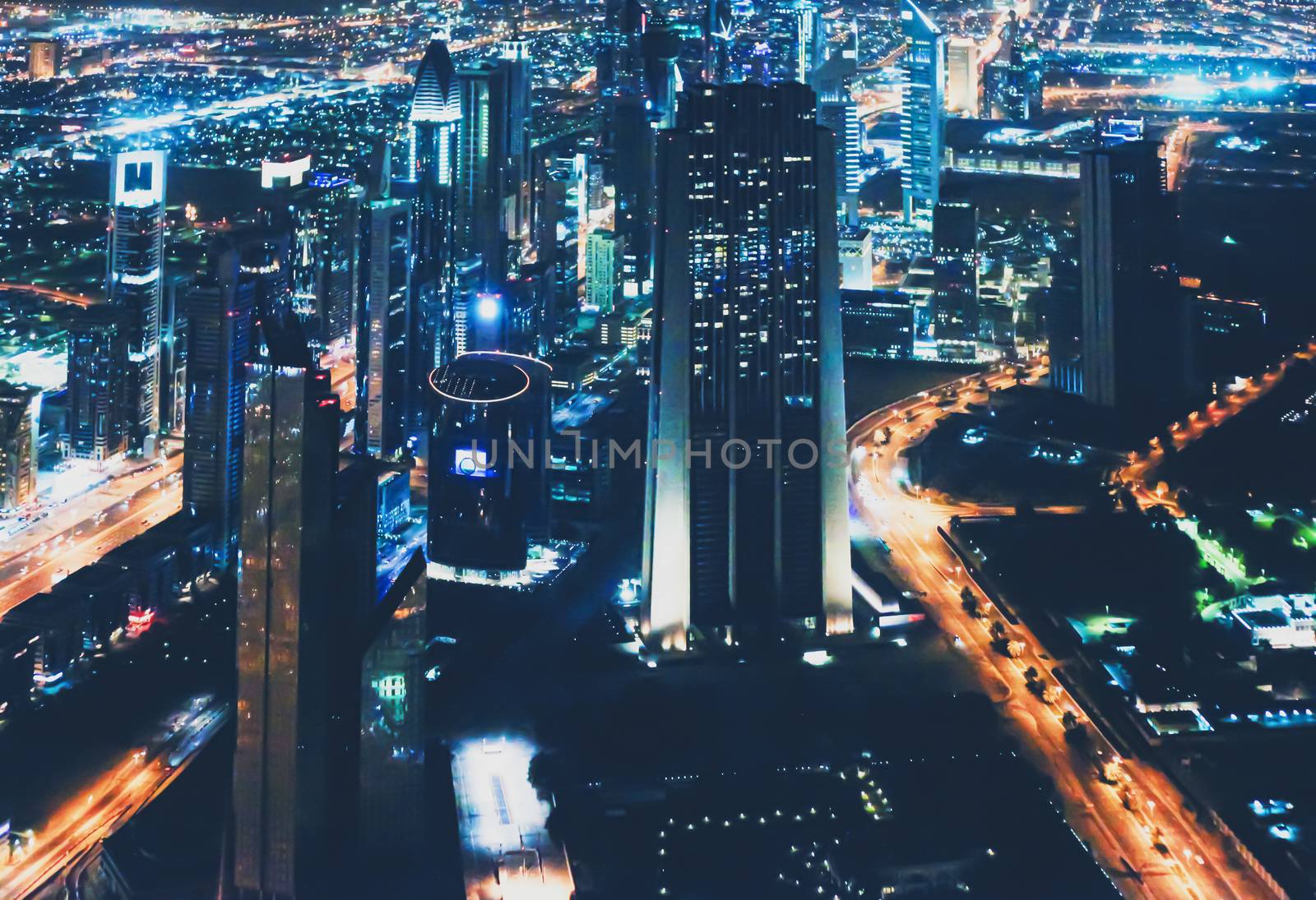 Aerial night view of Dubai in United Arab Emirates, metropolitan cityscape scenery