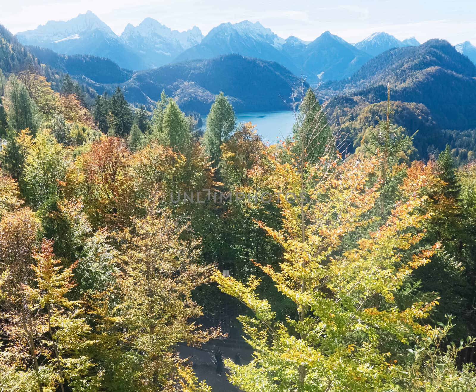 Beautiful nature of European Alps, landscape view of alpine mountains, lake and village on a sunny day, travel and destination scenery