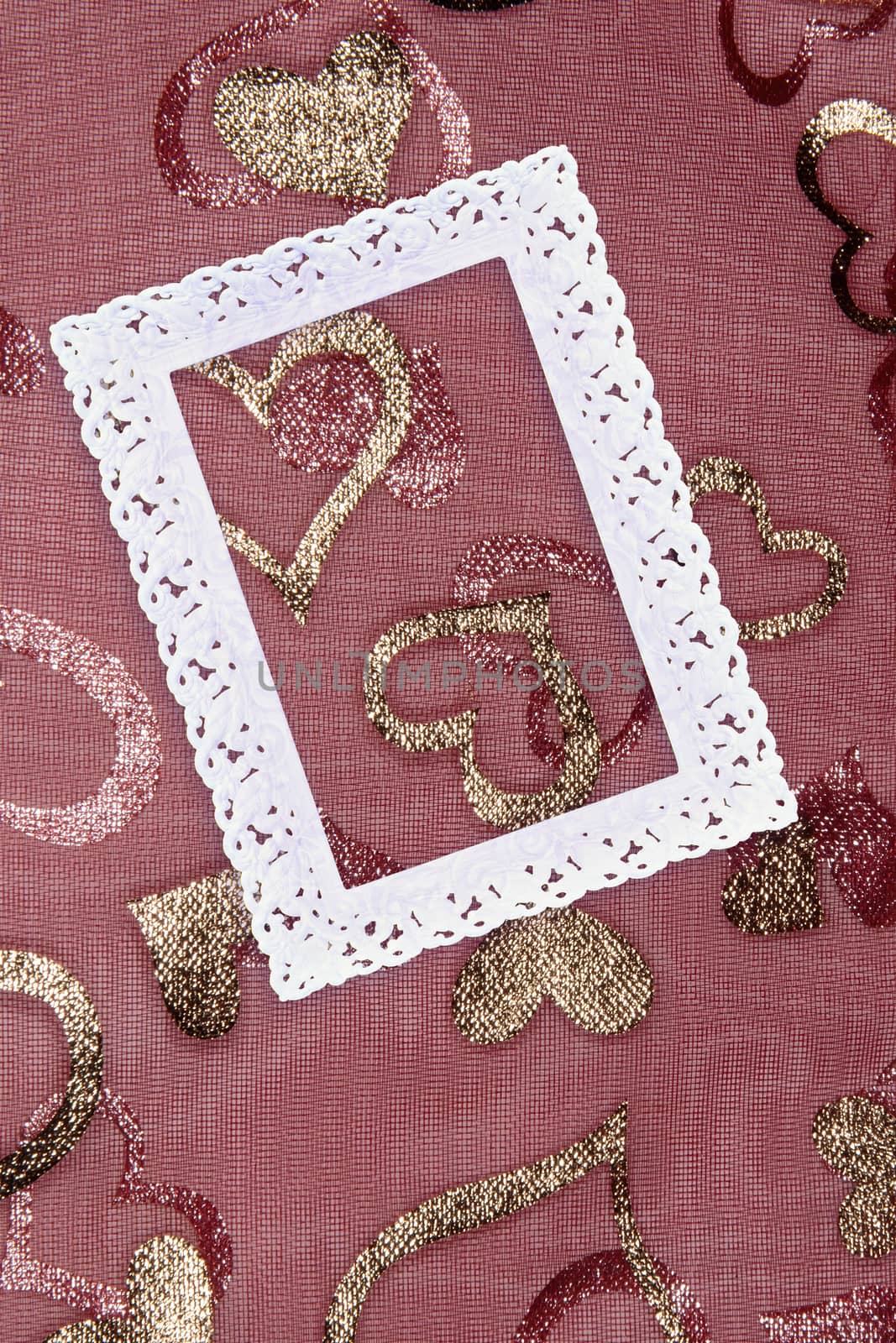 White openwork frame on a pink background with gold hearts. Love heart frame. Happy mother's day concept. Love symbol. Holiday card background, copy space for text.