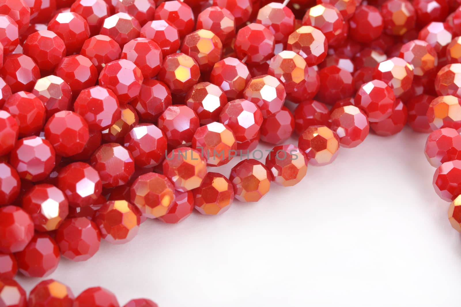 Beautiful Red Glass Sparkle Crystal Isoalted Beads on white background. Use for diy beaded jewelry