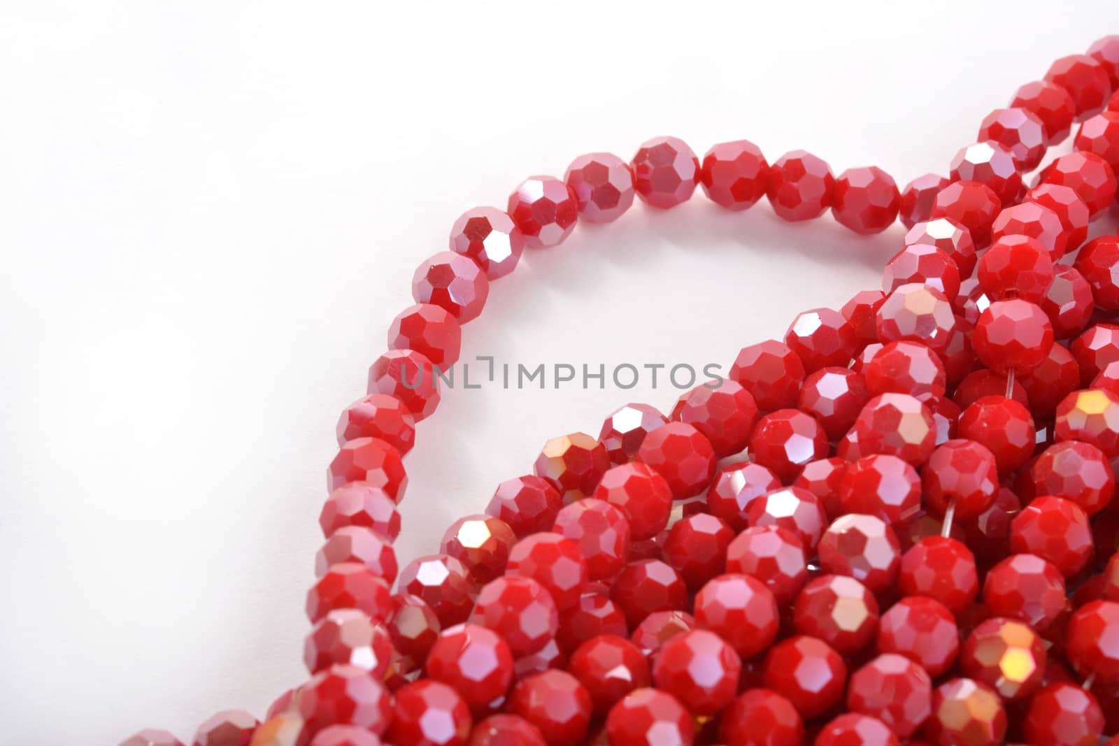 Beautiful Red Glass Sparkle Crystal Isoalted Beads on white background. Use for diy beaded jewelry