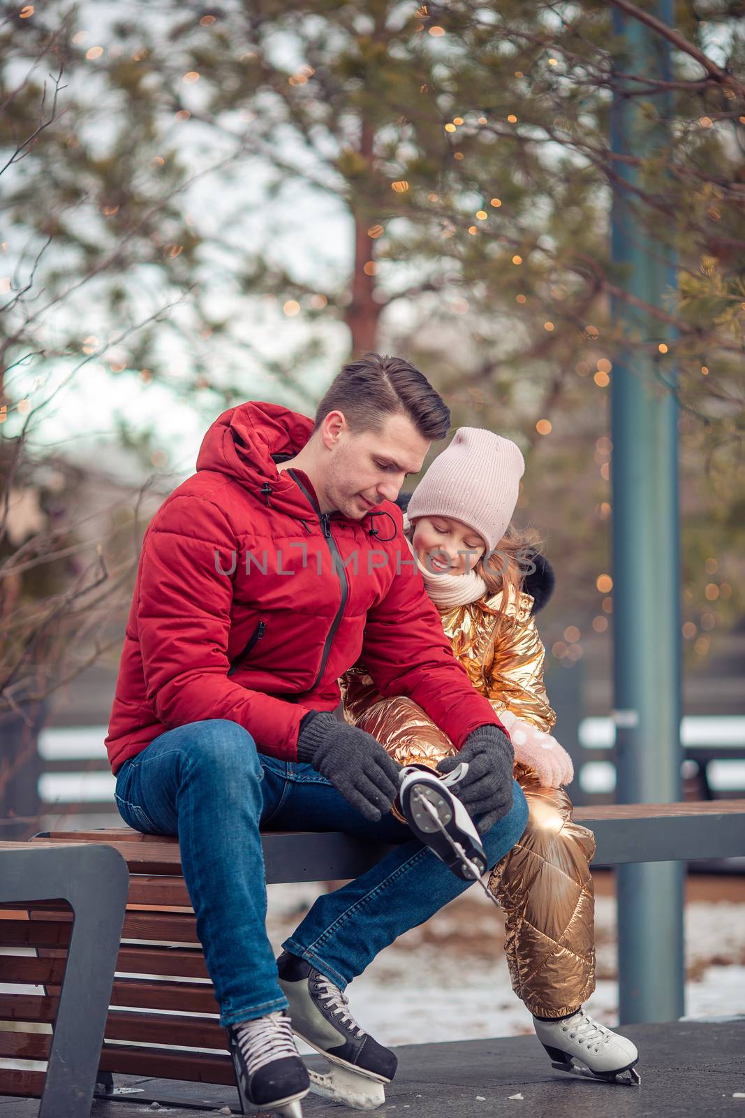 Family winter sport. Father and daughter on winter day by travnikovstudio