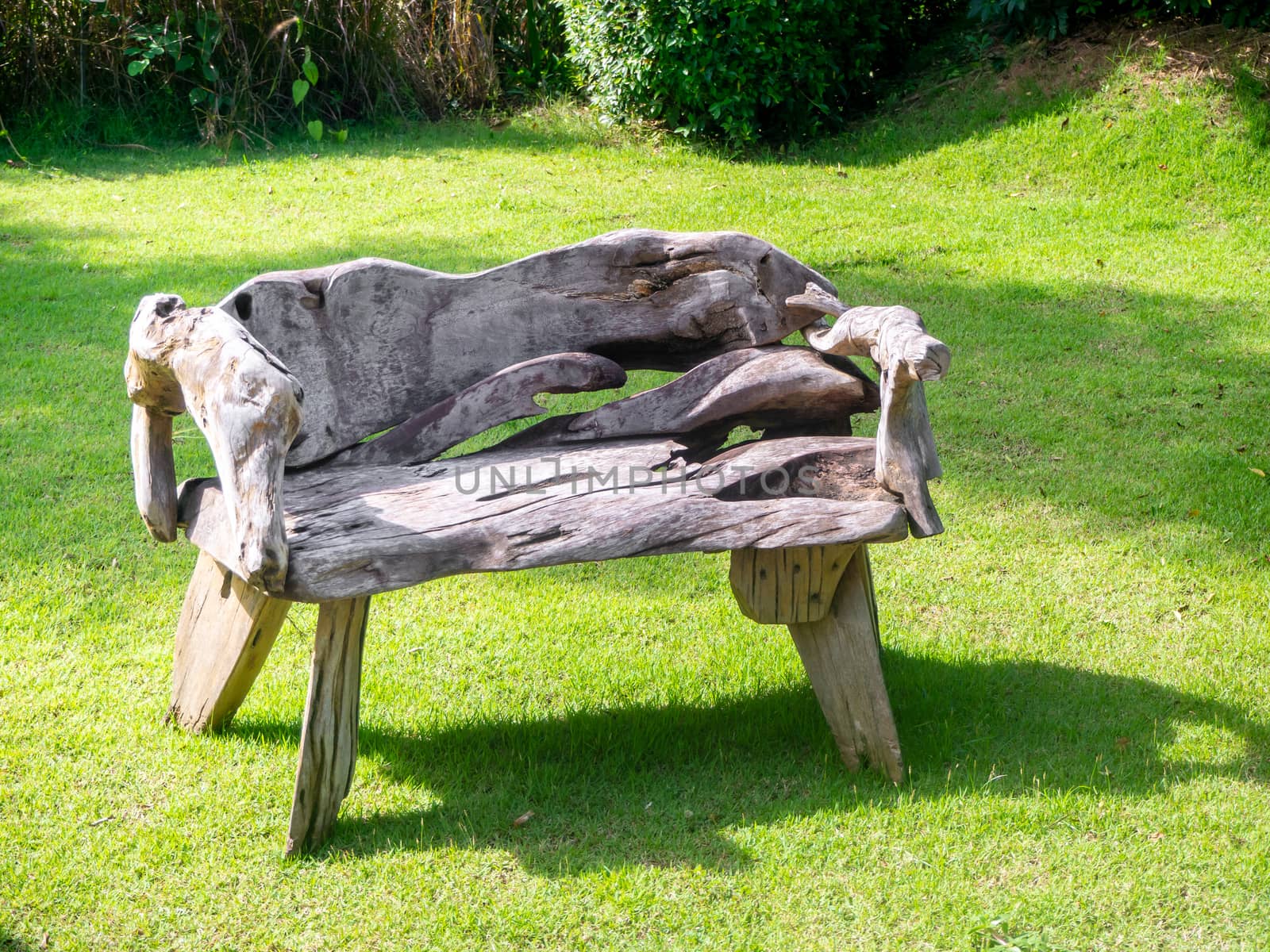 The Old wooden table set  in the green garden. by shutterbird