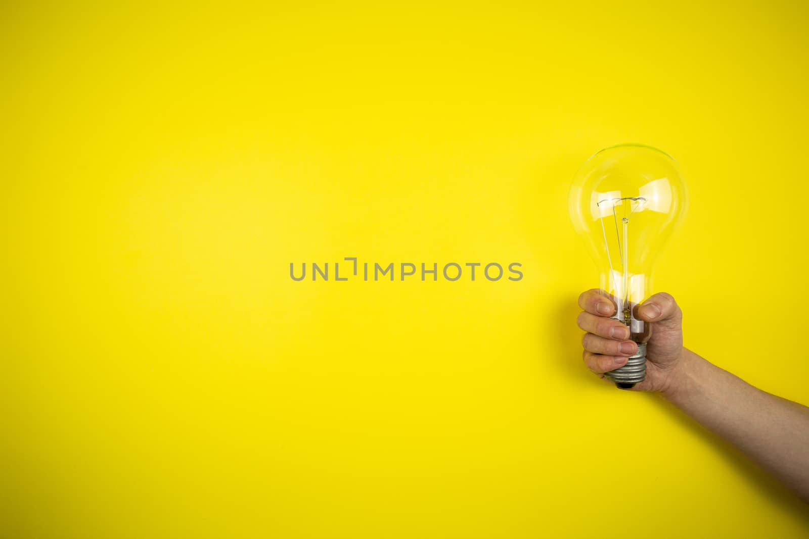 An idea came. Light bulb in hand