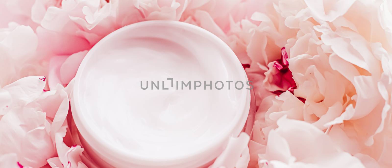 Luxe cosmetic cream jar as antiaging skincare routine product on background of peony flowers, body moisturizer and beauty branding design