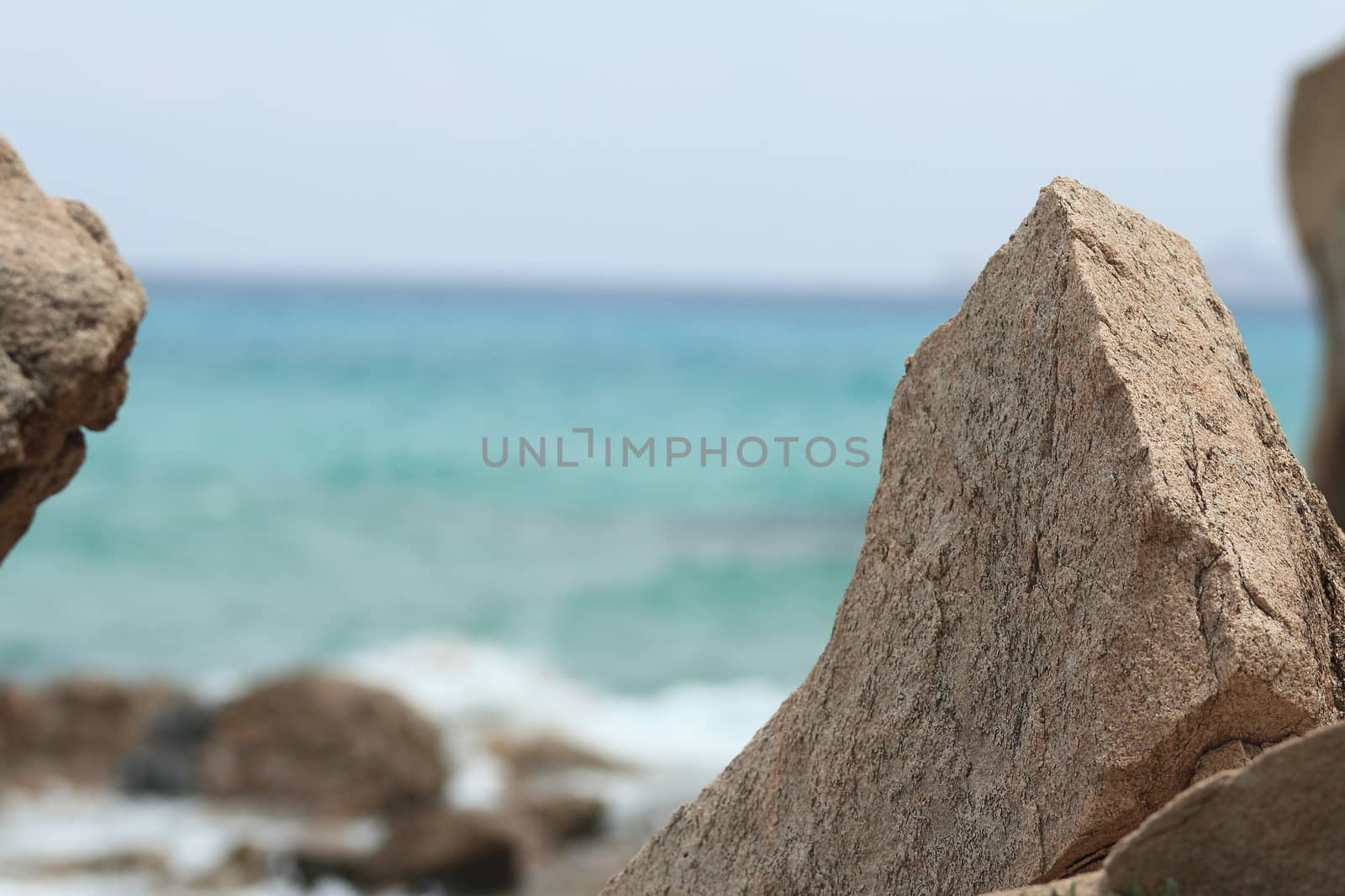 Sardinian rocky and natural beach landscape during a summer day