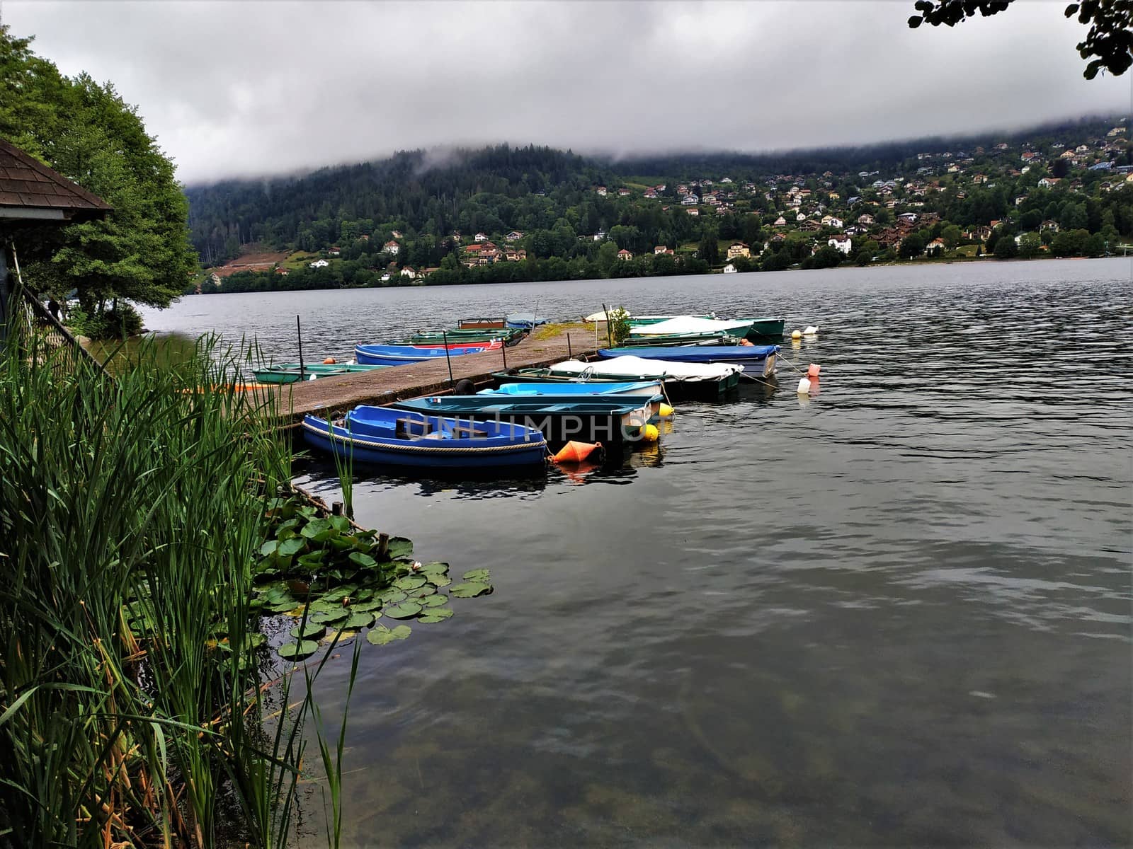 Small boats on a landing stage on the Lac de Gerardmer, France