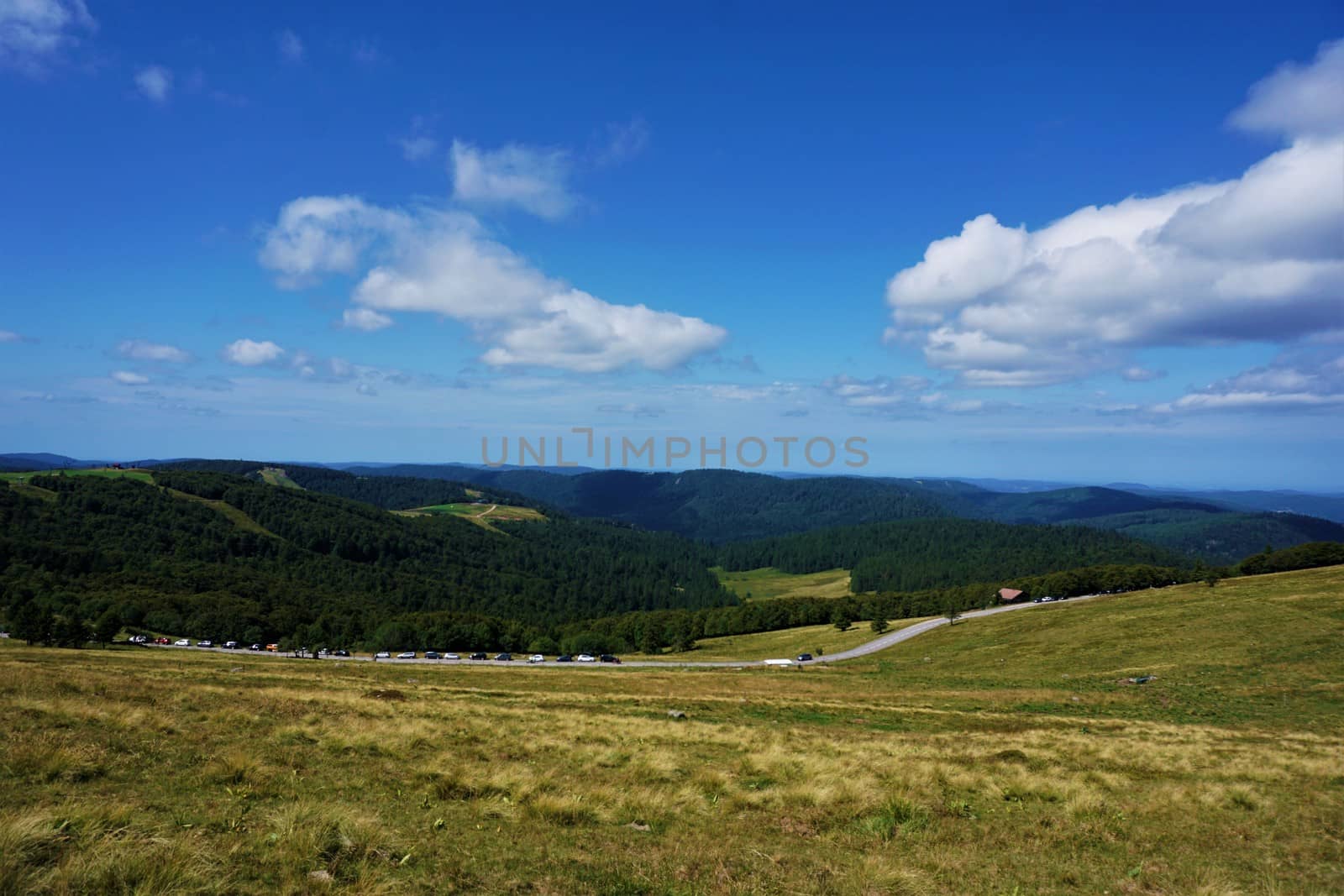 Beautiful view from Le Hohneck mountain over the hilly landscape of the Vosges mountain range in France