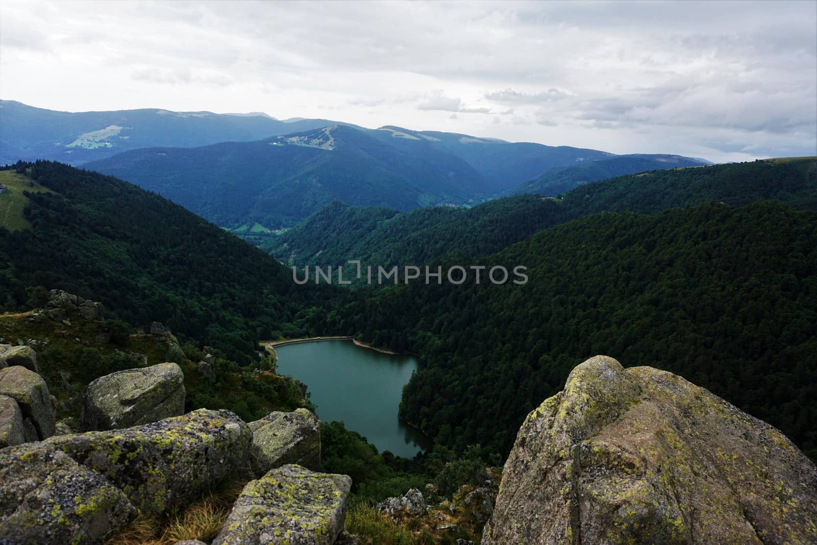 View on lake Schiessrothried with big rocks and hilly landscape of the Vosges by pisces2386