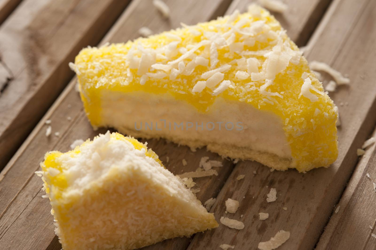 Lemon flavored lamington on sponge cake by stockarch