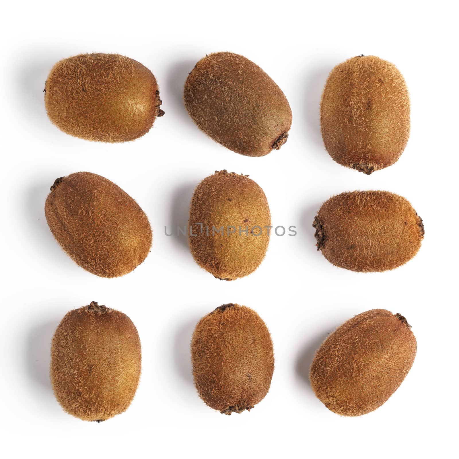 Pattern of whole kiwi fruits. Square seamless pattern of kiwi isolated on white with clipping path. Top view or flat-lay.