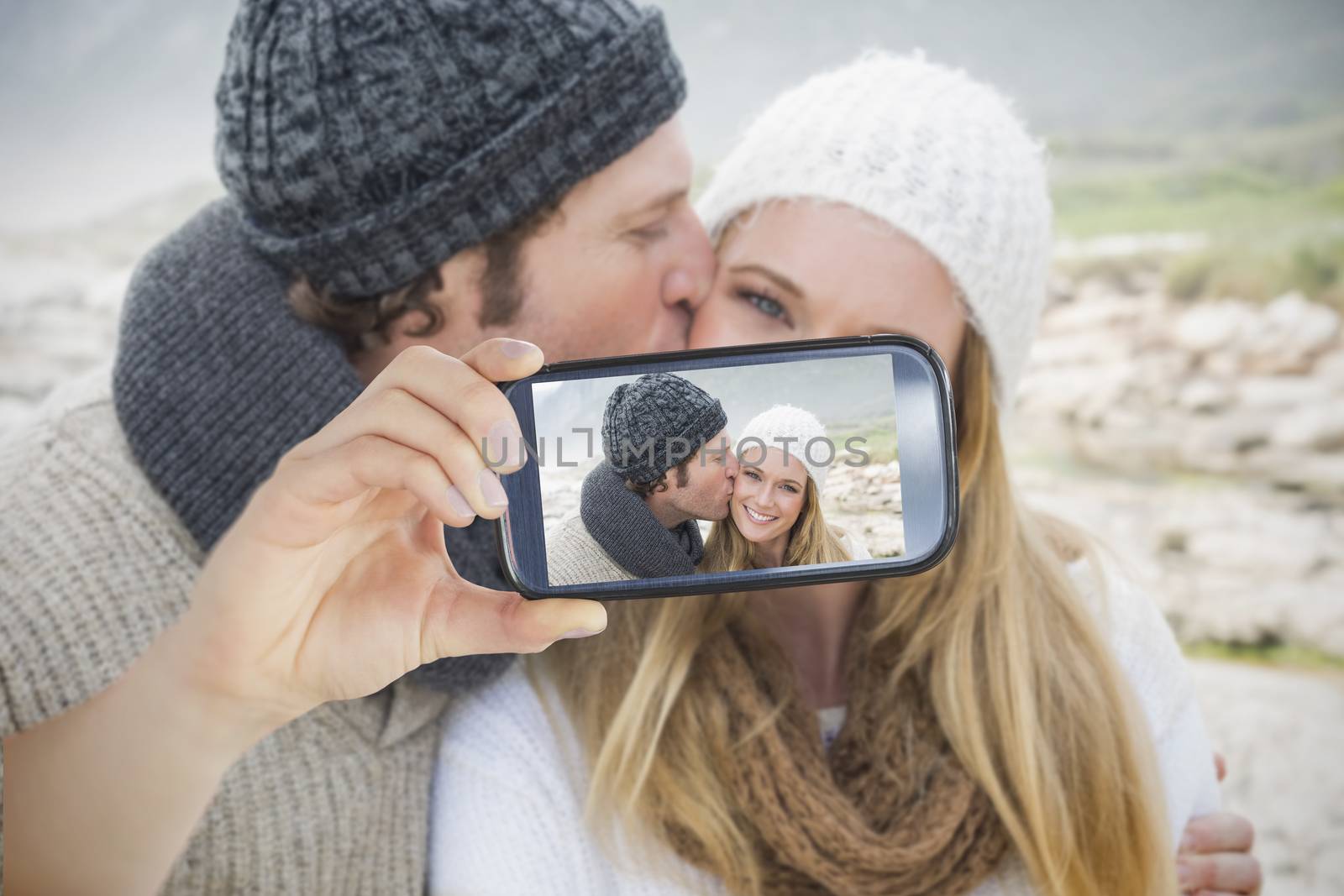 Couple taking selfie on smartphone by Wavebreakmedia