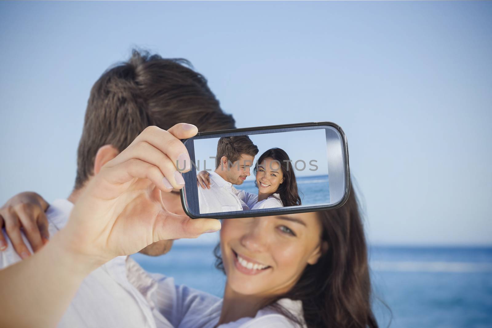 Couple taking selfie on smartphone by Wavebreakmedia