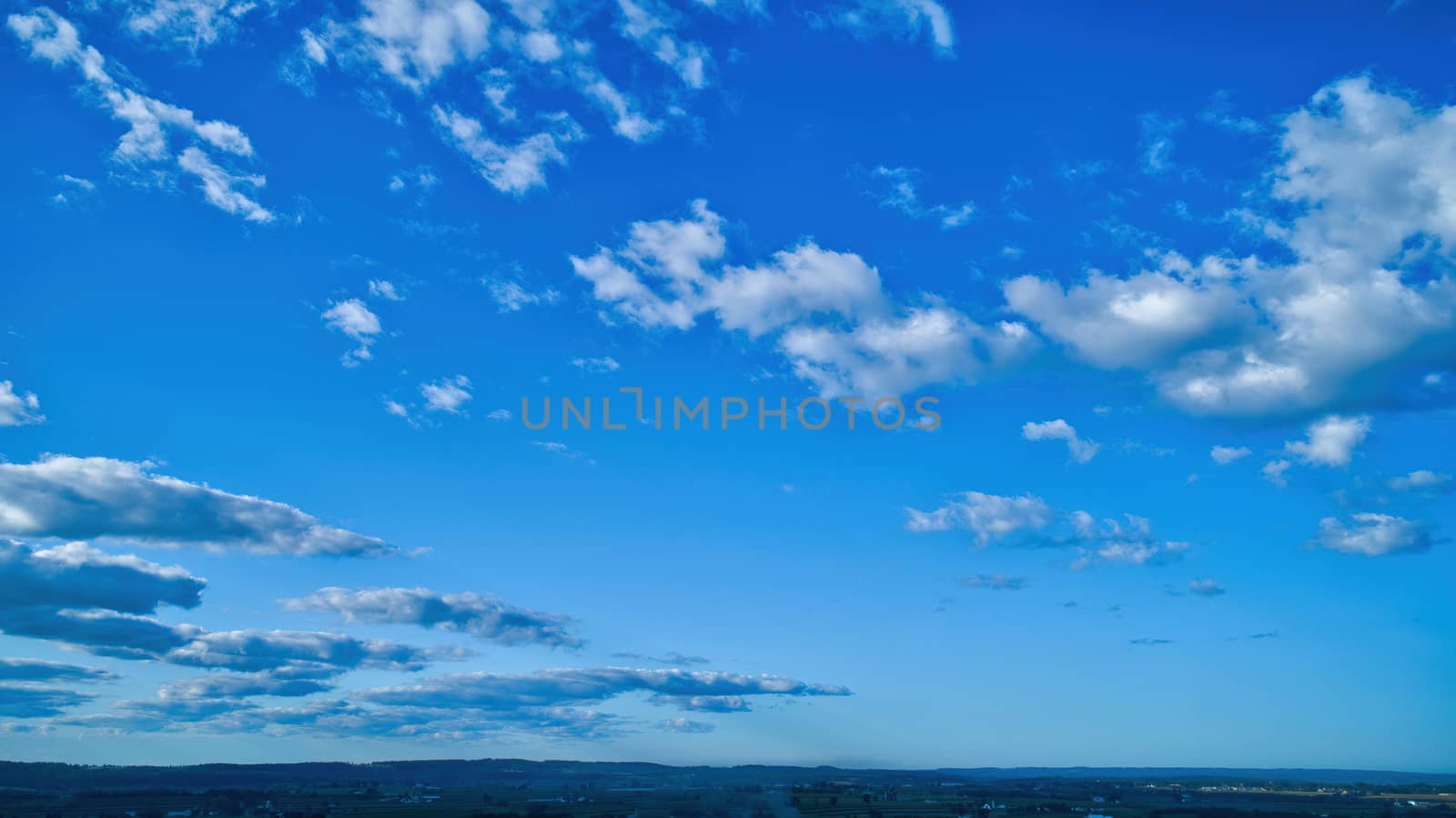 Blue sky and multiple clouds background