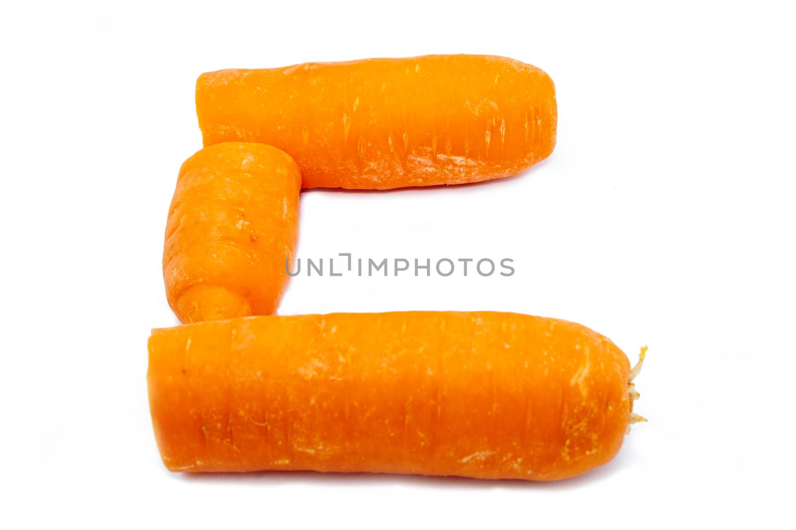 The C is a carrot. Bright capital letter C made of round carrot slices at white background