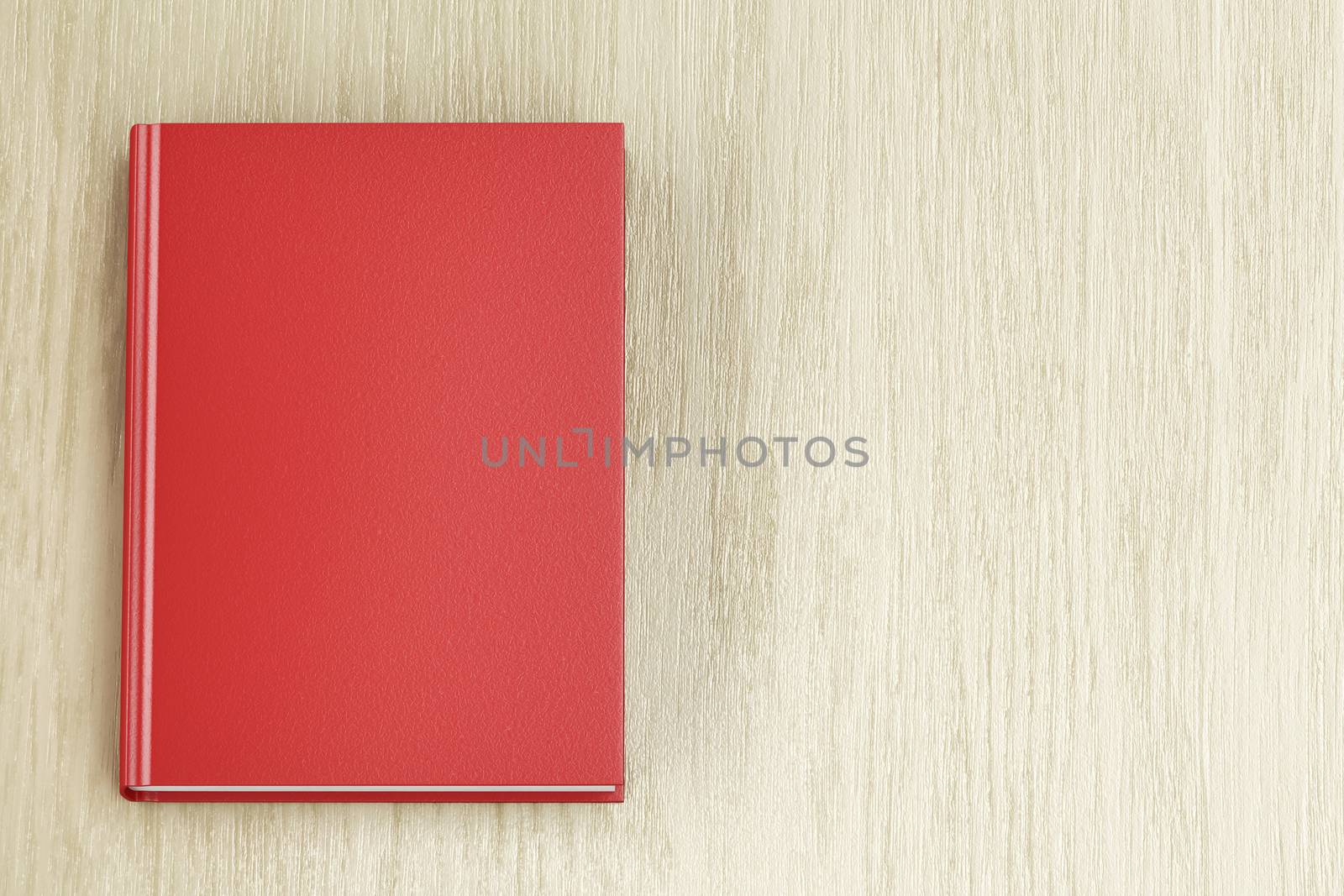 Red book on wooden table, top view