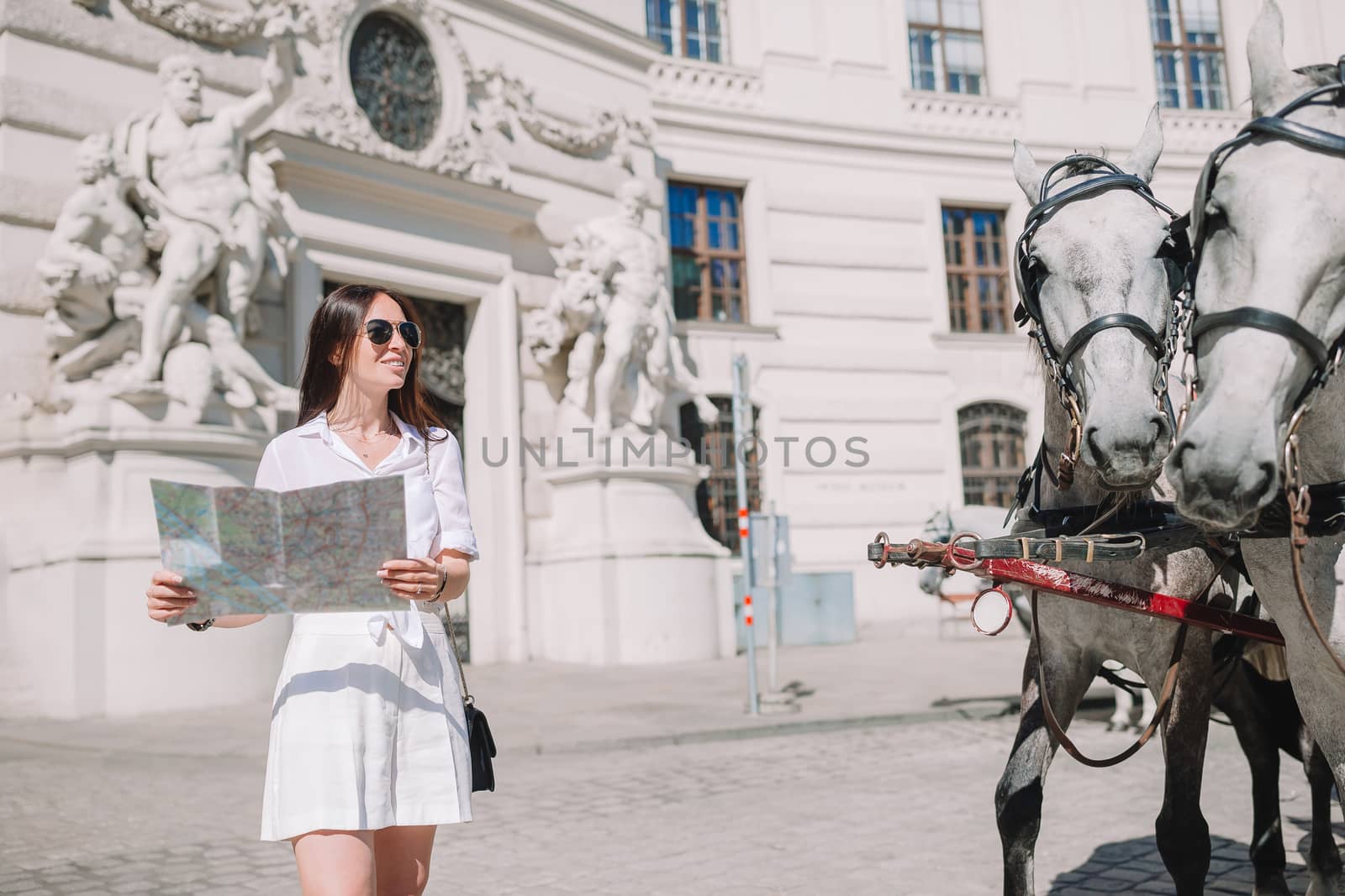 Woman walking in city. Young attractive tourist outdoors in italian city by travnikovstudio