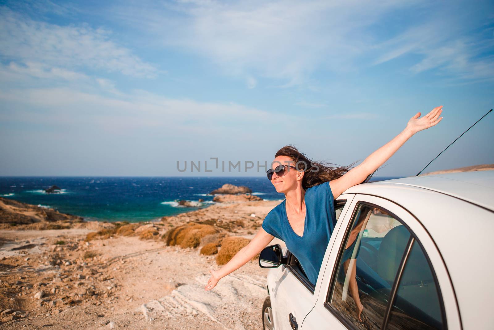 Young woman on vacation travel by car. by travnikovstudio