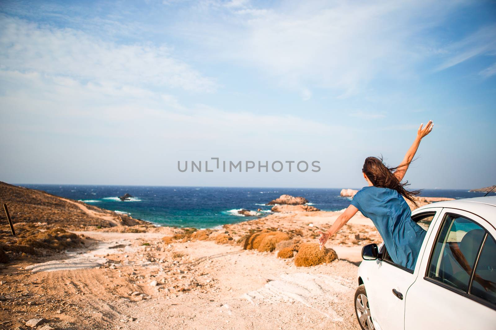 Young woman on vacation travel by car. by travnikovstudio