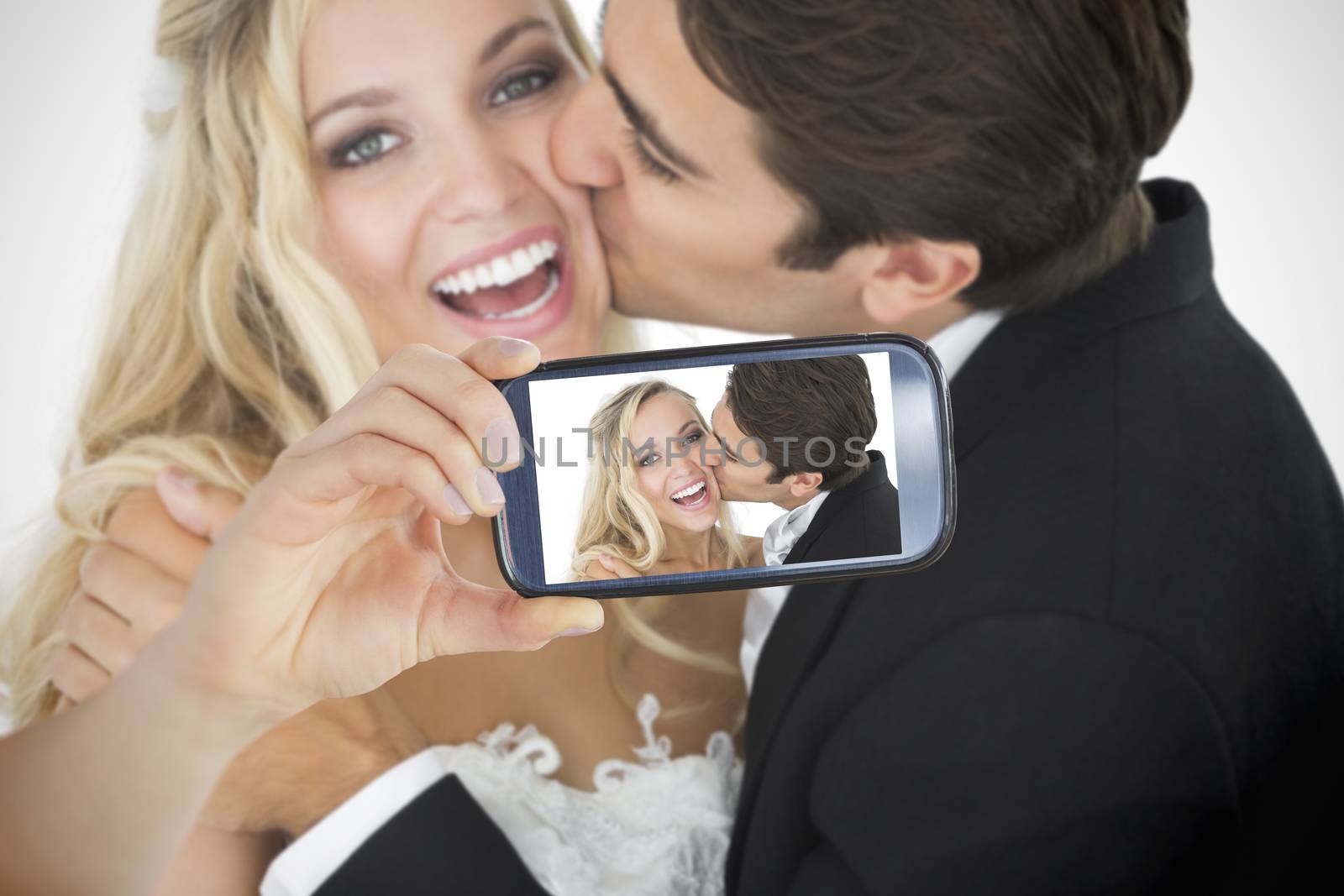 Composite of Couple taking selfie on smartphone