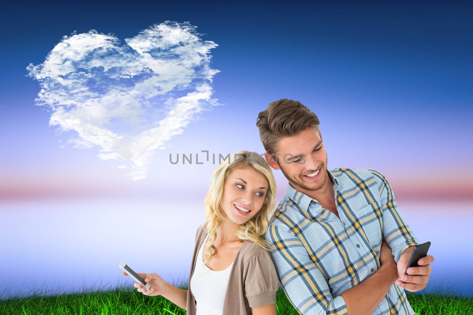 Attractive couple using their smartphones against cloud heart