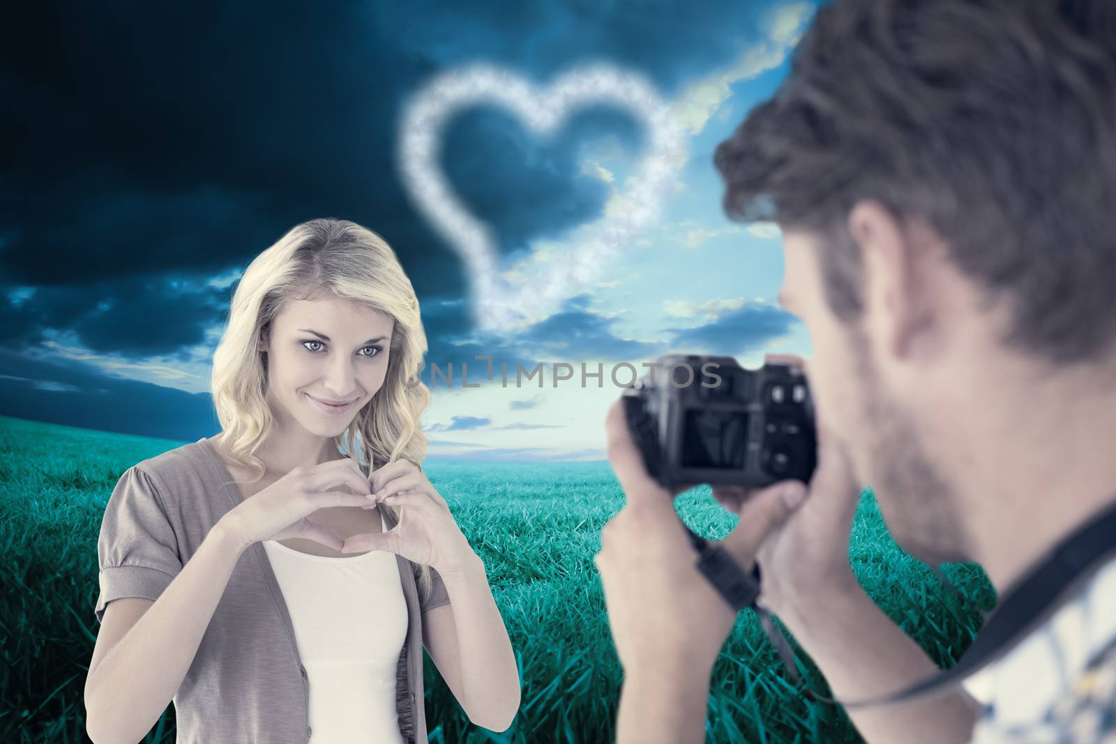 Composite image of man taking photo of his pretty girlfriend by Wavebreakmedia