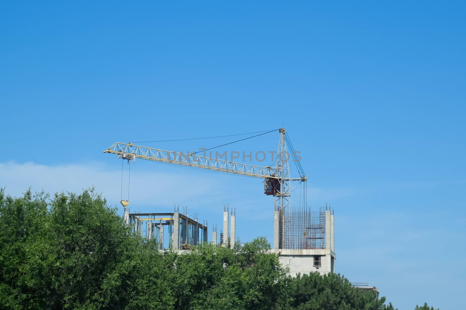 construction of multi storey residential buildings. Tower cranes at a construction site. by fedoseevaolga