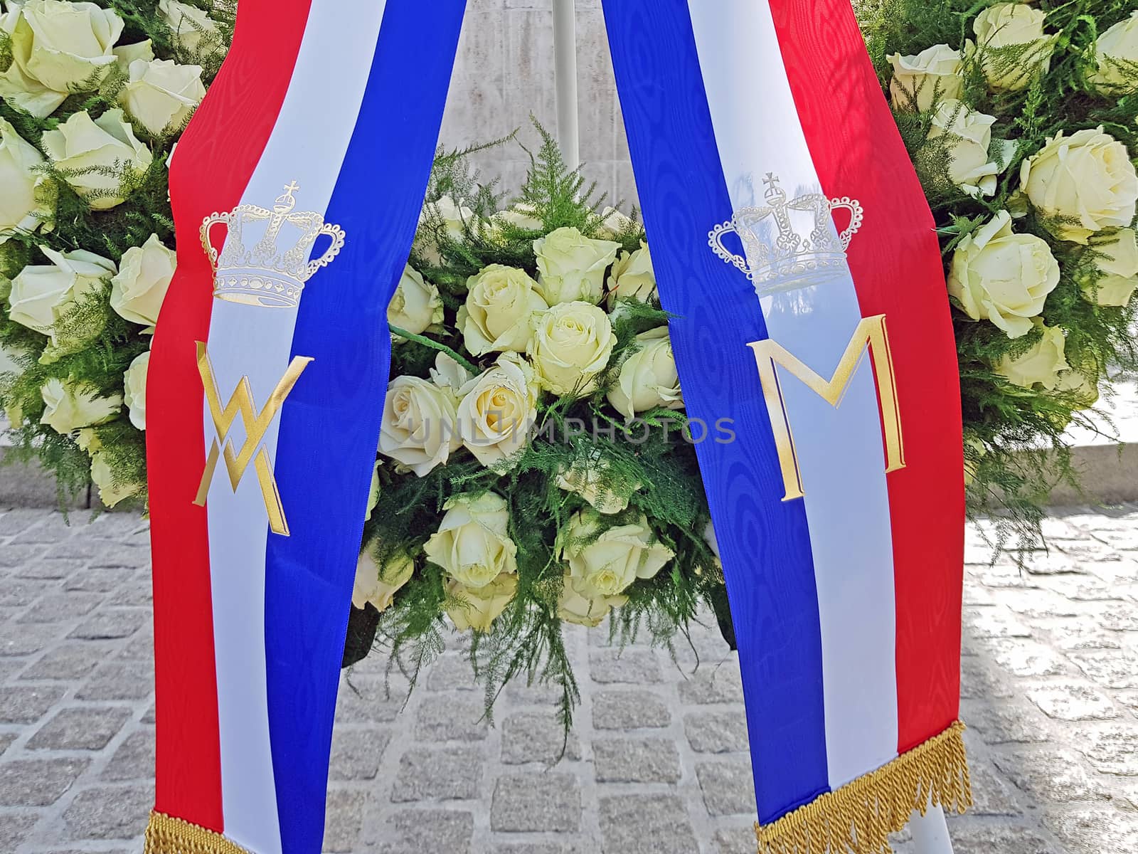 Amsterdam, Netherlands - May 4, 2020: Wreath laying at the National Monument on the Dam by the king and the queen from the Netherlands