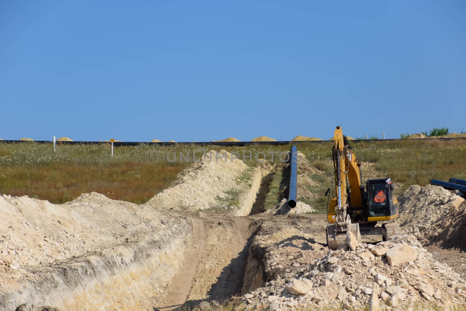 Construction of the pipeline. Underground gas pipeline, pipeline laying underground. by fedoseevaolga