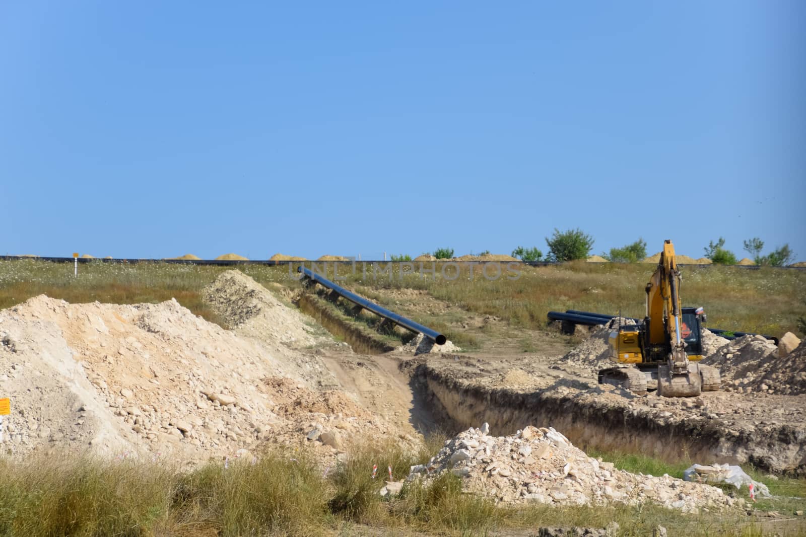 Construction of the pipeline. Underground gas pipeline, pipeline laying underground. by fedoseevaolga