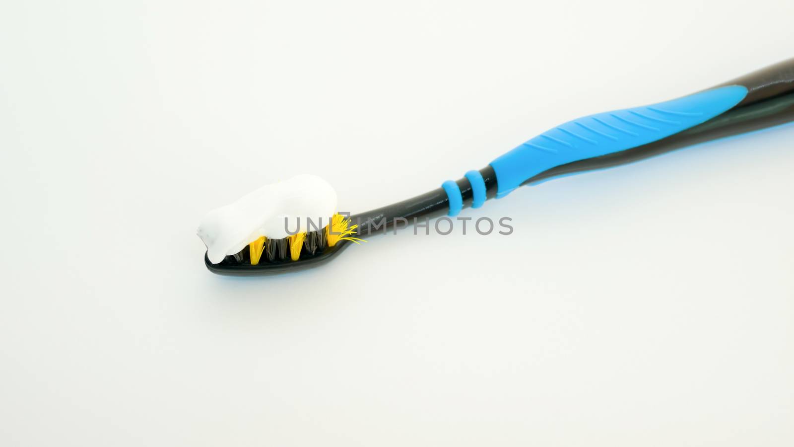 top view of toothbrush spread with toothpaste