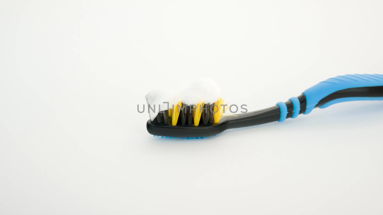 toothpaste on a brush white background