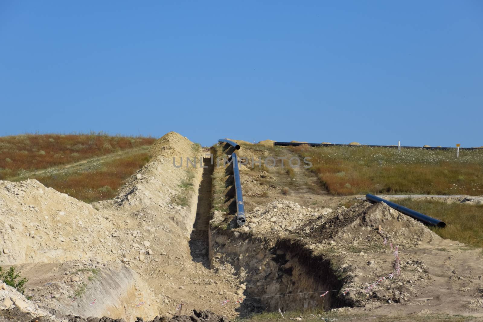 Construction of the pipeline. Underground gas pipeline, pipeline laying underground. by fedoseevaolga