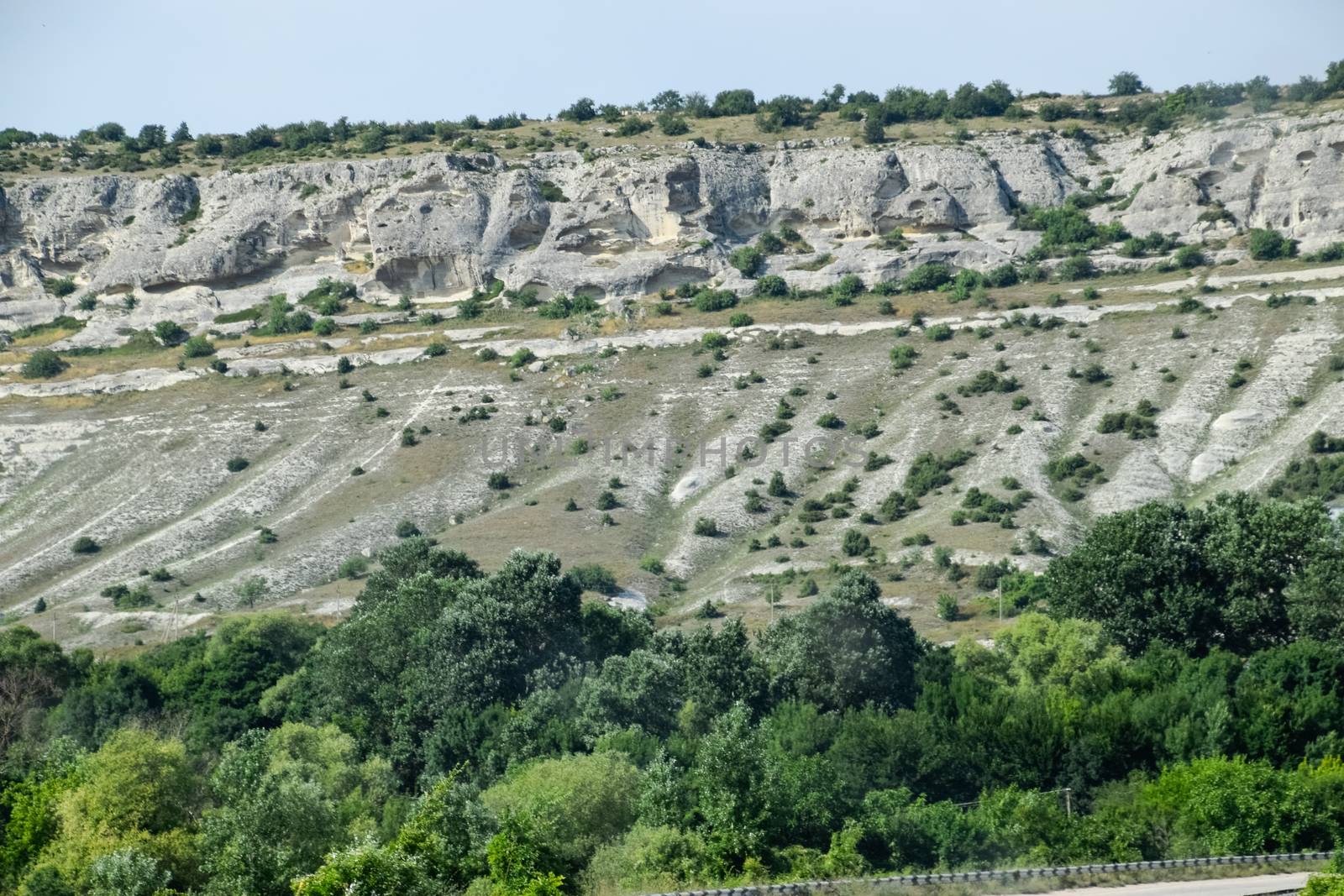 Limestone cliffs with a sample of material, limestone erosion in the rocks.